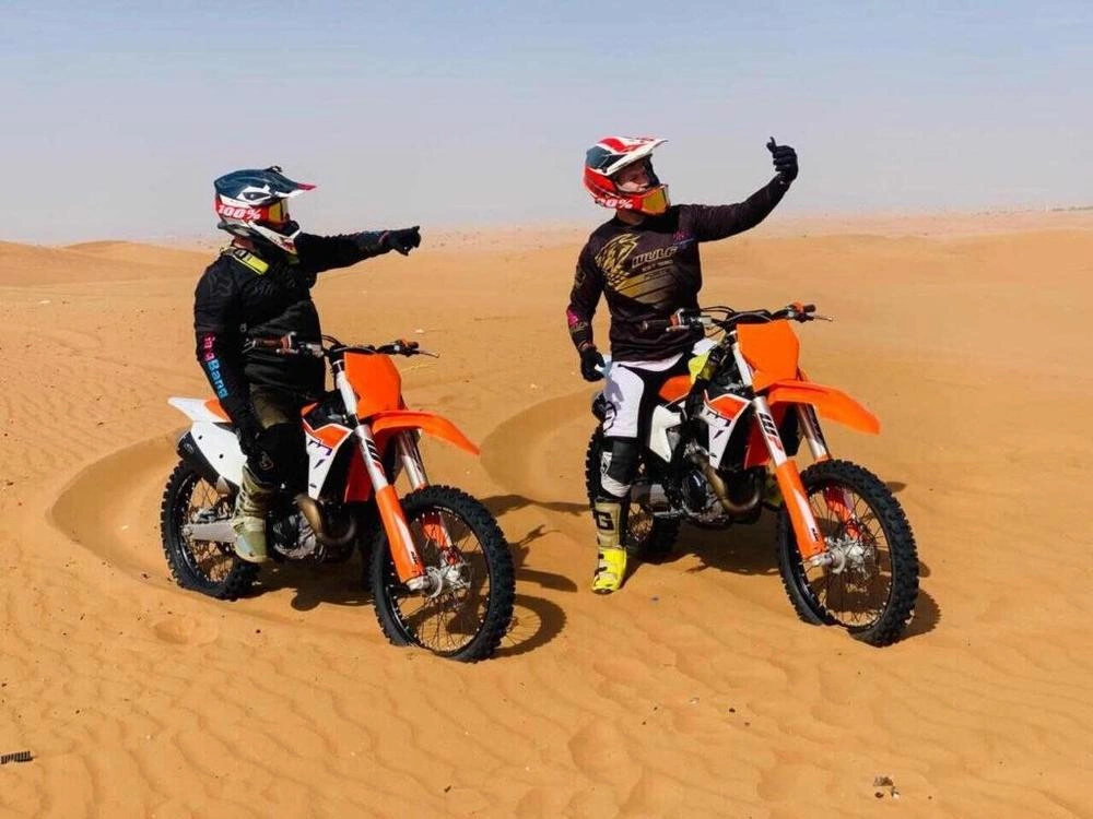 Dirt bikes on Dubai desert dunes