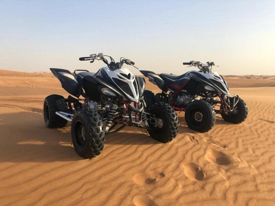 Yamaha Raptor sport quads on Dubai red dunes